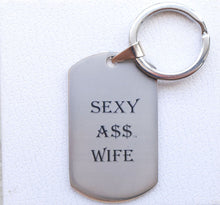 Load image into Gallery viewer, &quot;THE TAGGER&quot; SEXY A$$ WIFE CHARM/KEYCHAIN
